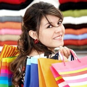 Woman smiles after making her Mystery Shopping purchases